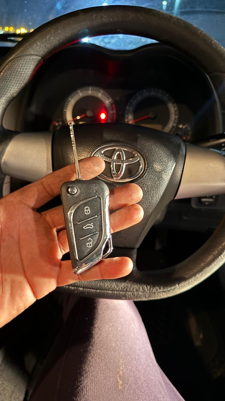 Toyota transponder flip key in front of the steering wheel
